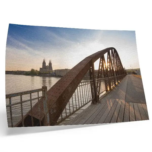 Poster peaceful sunset over a metal bridge at the cathedral river