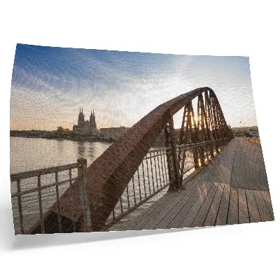 Poster peaceful sunset over a metal bridge at the cathedral river