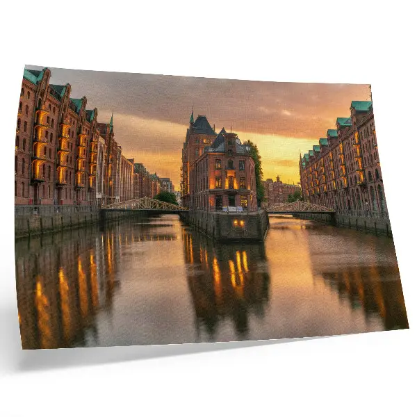 Decorative canvas print calm water reflecting brick buildings in warm light