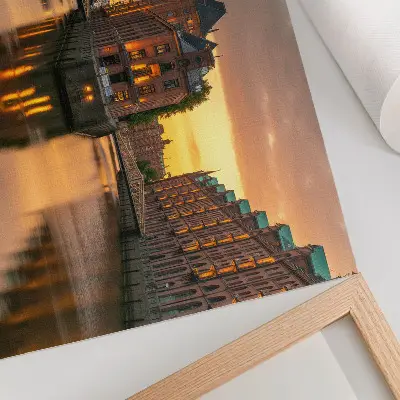 Decorative canvas print calm water reflecting brick buildings in warm light