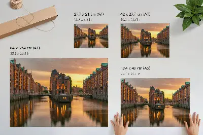 Decorative canvas print calm water reflecting brick buildings in warm light