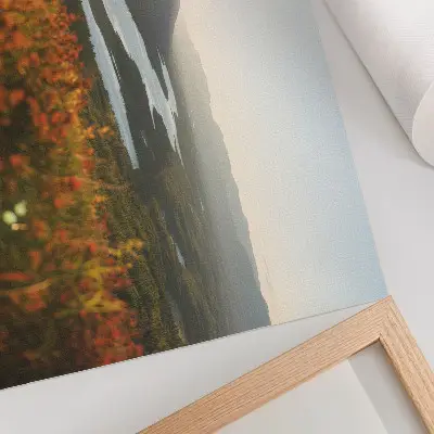 Poster featuring a peaceful atmosphere with flowers, mountains, a river, and a sunset