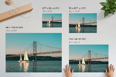 Photo canvas A bridge and sailboats over the water in pastel tones