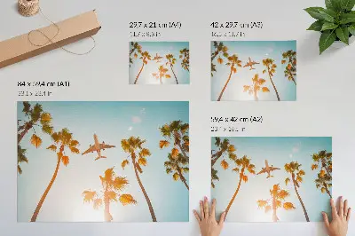 Poster airplane flying over tropical palm trees under a blue sky