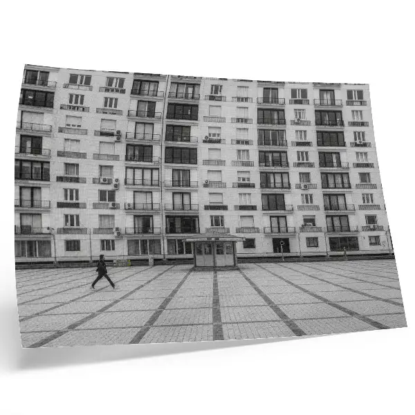 Modern building with balconies and a square poster