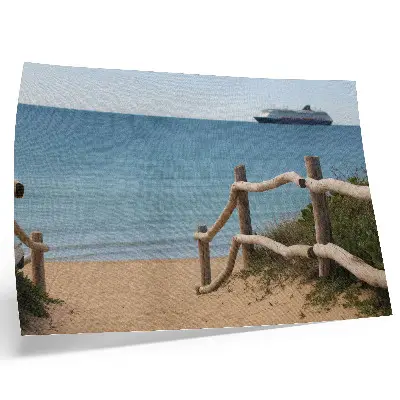 Decorative canvas print featuring a beach with a ship, sea, wooden railings, and sand