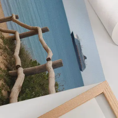 Decorative canvas print featuring a beach with a ship, sea, wooden railings, and sand