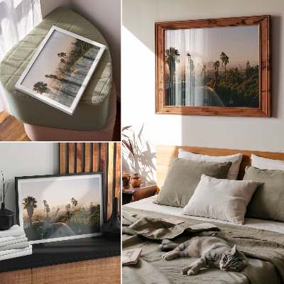 Photo canvas Palm trees and the city skyline in the sunshine