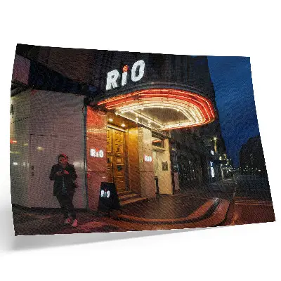 Decorative canvas print featuring retro cinema neon lights in red and cream