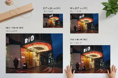 Decorative canvas print featuring retro cinema neon lights in red and cream