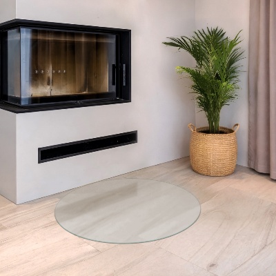 Glass hearth pad in a round semi-transparent design