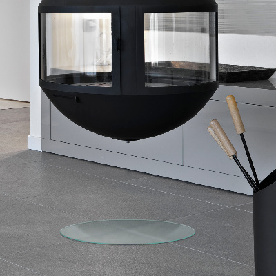 Glass hearth pad in a round semi-transparent design