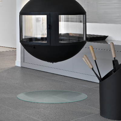 Glass hearth pad in a round semi-transparent design
