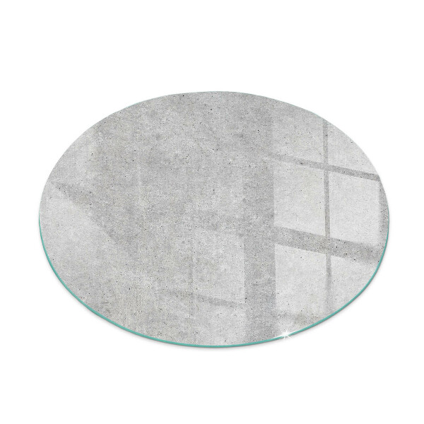 Glass hearth for stove round Raw concrete texture