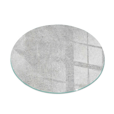 Glass hearth for stove round Raw concrete texture