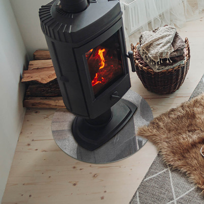Glass hearth for stove round Raw concrete texture