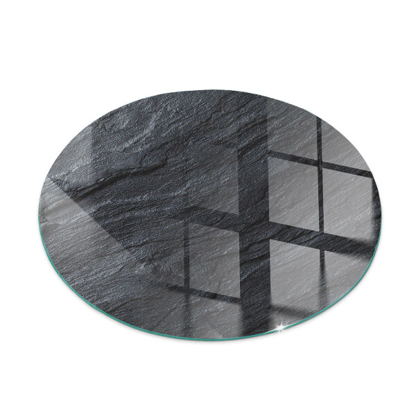 Glass hearth for stove round Stone surface texture