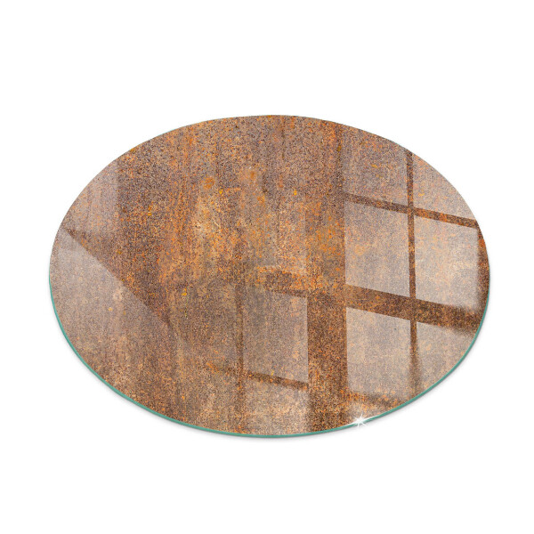 Glass hearth for stove round Rust texture on the background