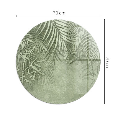 Glass hearth for stove round Tropical leaves in the background