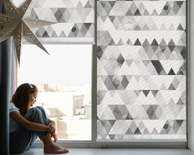 Fabric roller blind with a gray triangle pattern