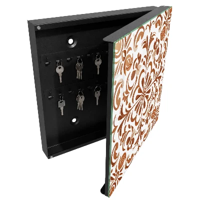 Key cabinet with an ornamental pattern