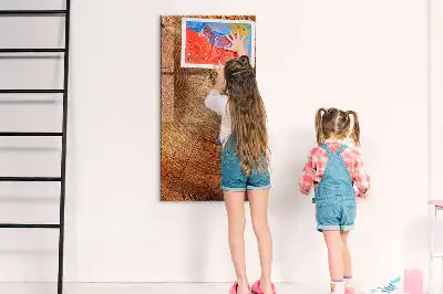 Dry erase magnetic board with a tree trunk cross-section design