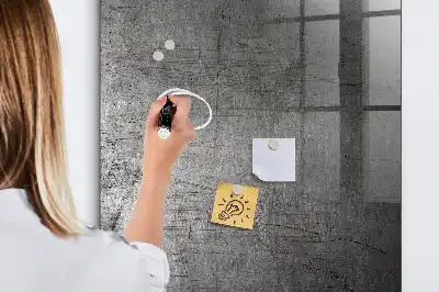 Dry erase magnetic board with a scratched metal finish