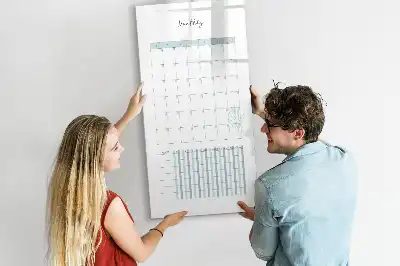 Monthly planner board with magnetic erase surface