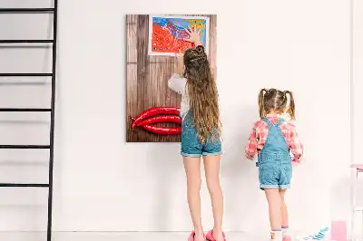Magnetic erase board with wooden chili pepper design