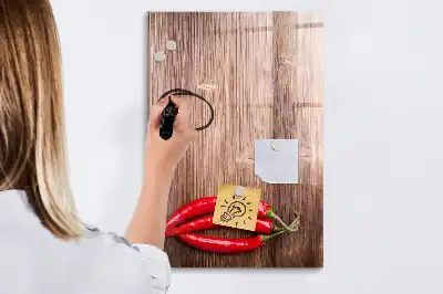 Magnetic erase board with wooden chili pepper design