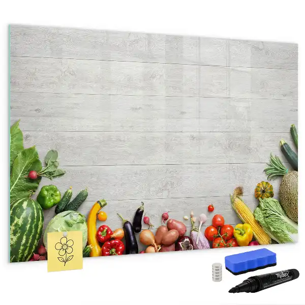 Magnetic marker board featuring a table with vegetables