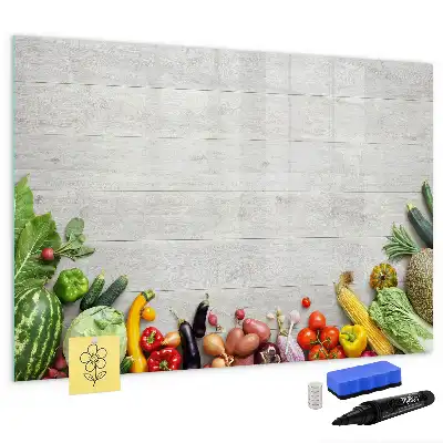 Magnetic marker board featuring a table with vegetables