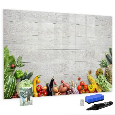 Magnetic marker board featuring a table with vegetables