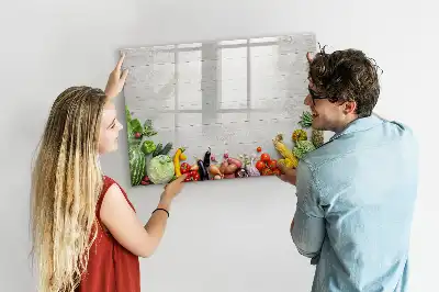 Magnetic marker board featuring a table with vegetables