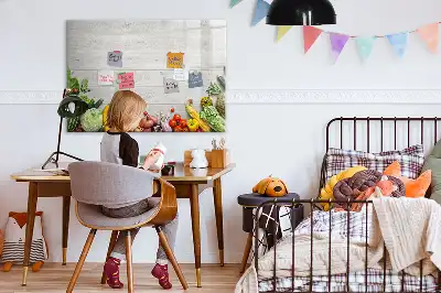 Magnetic marker board featuring a table with vegetables