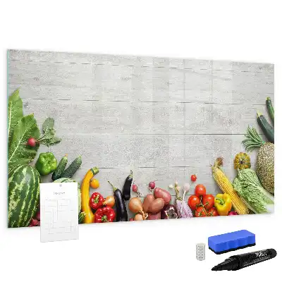Magnetic marker board featuring a table with vegetables