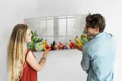 Magnetic marker board featuring a table with vegetables