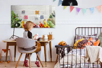 Magnetic marker board featuring a table with vegetables