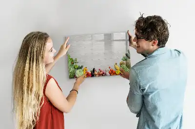 Magnetic marker board featuring a table with vegetables