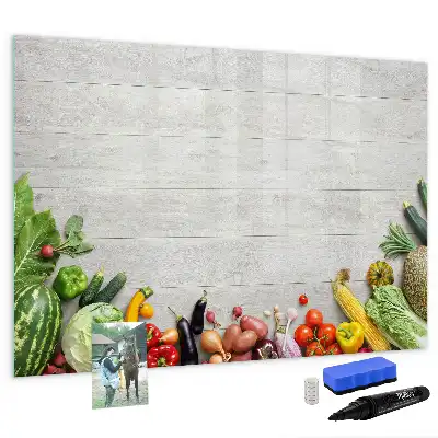 Magnetic marker board featuring a table with vegetables