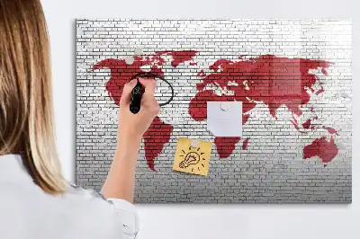 Magnetic marker board world map on brick wall