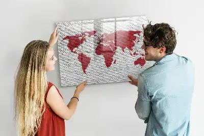Magnetic marker board world map on brick wall