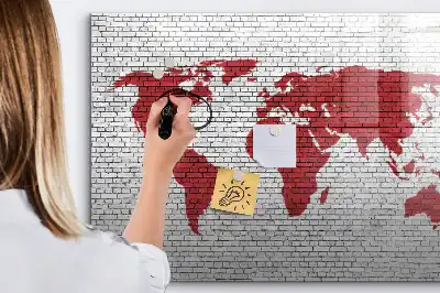 Magnetic marker board world map on brick wall