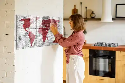 Magnetic marker board world map on brick wall