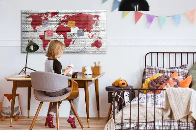 Magnetic marker board world map on brick wall