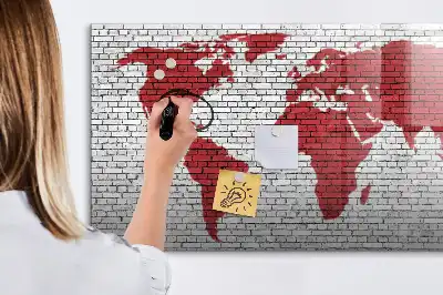 Magnetic marker board world map on brick wall