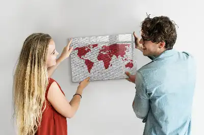 Magnetic marker board world map on brick wall