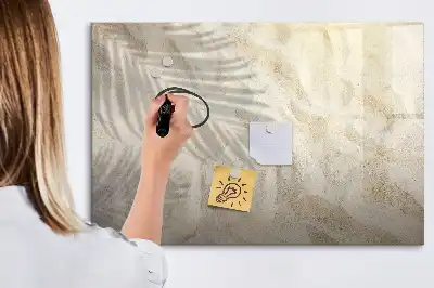 Magnetic glass dry erase board shadow on the sand