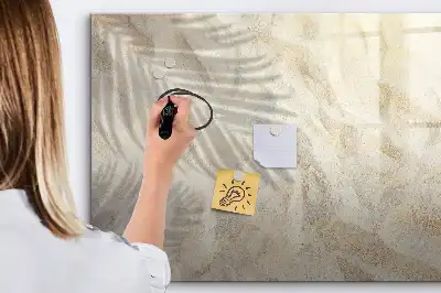 Magnetic glass dry erase board shadow on the sand