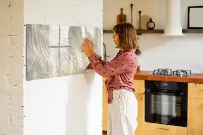 Magnetic glass dry erase board shadow on the sand